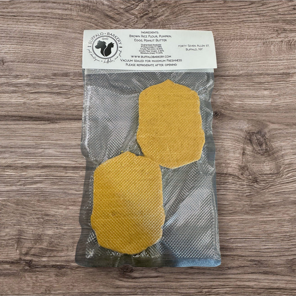 Buffalo Freeze Dry Buffalo Barkery Cookies in a clear package, showcasing the crunchy, natural dog treats inside.