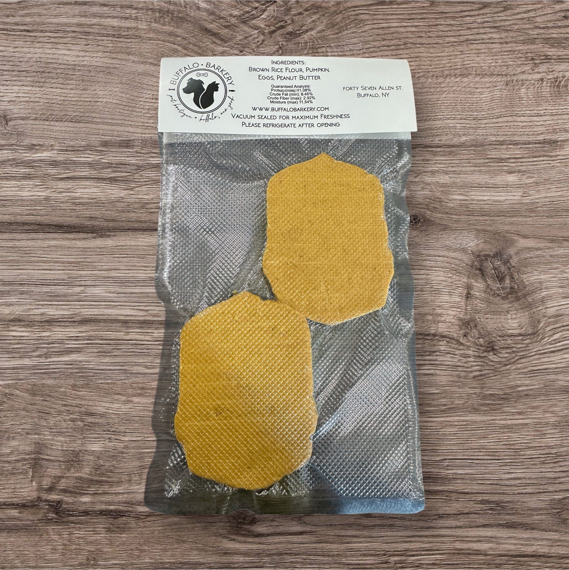 Buffalo Freeze Dry Buffalo Barkery Cookies in a clear package, showcasing the crunchy, natural dog treats inside.